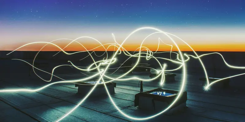 Abstract image taken with a long exposure of light lines over sunset
