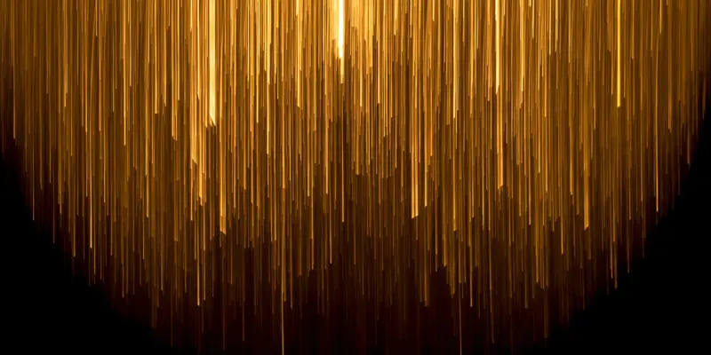 Abstract image showing a shower of warm lights against a dark background
