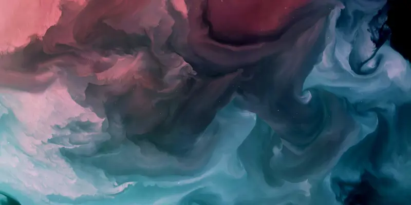 Abstract image showing pink and blue clouds of ink