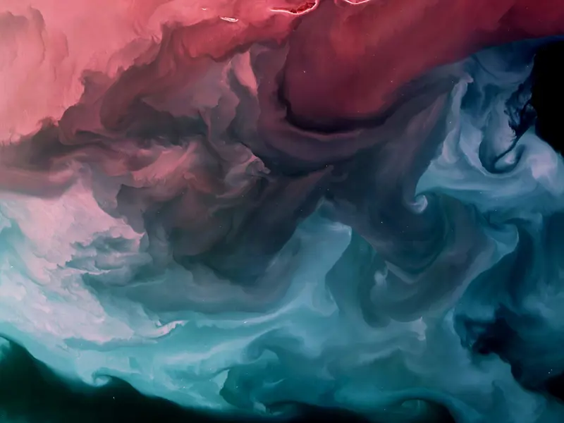 Abstract image showing pink and blue clouds of ink