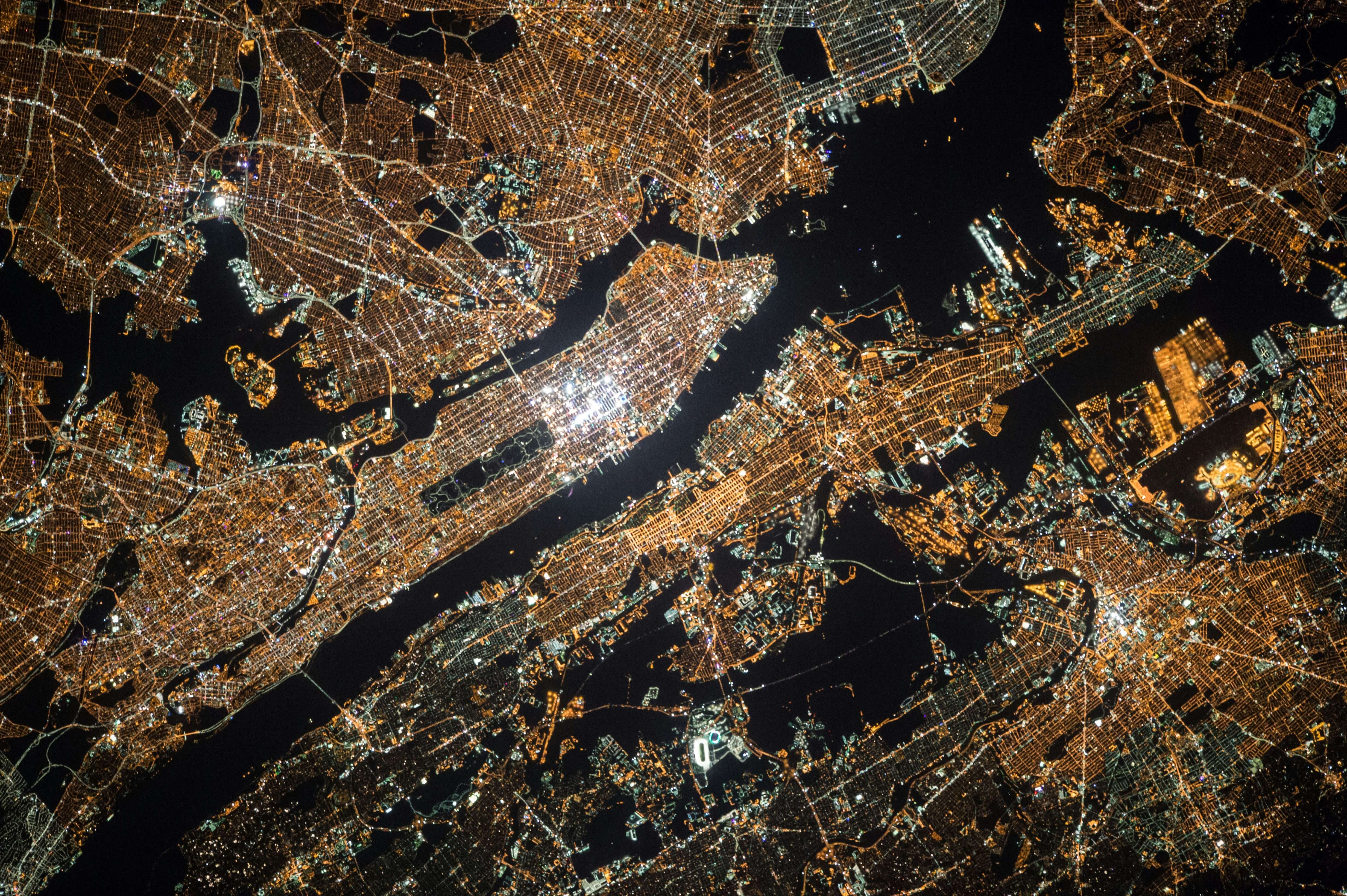 Image showing Manhattan island lit up at at night, taken by a satellite 