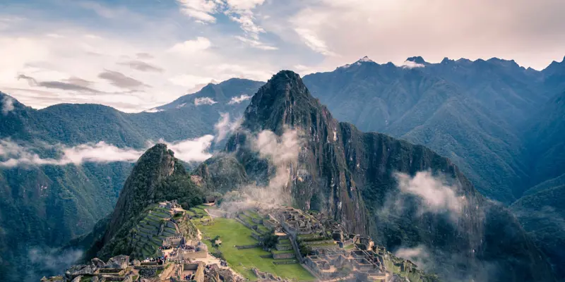 Image of a mountain peak in Peru with a ruined village at the base