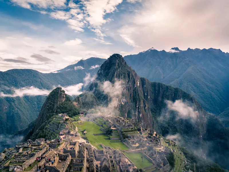 Image of a mountain peak in Peru with a ruined village at the base